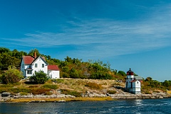 Weathered Squirrel Point Light by the Kennebec River
